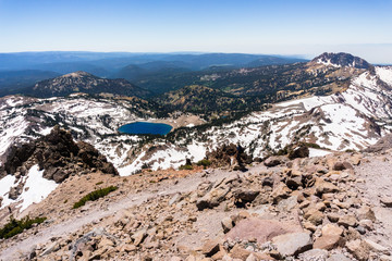 High altitude hiking trail to Lassen Peak; Lake Helen in the background; Lassen Volcanic National Park, California