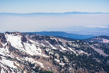 View towards Sacramento Valley and Redding as seen from Lassen Volcanic National Park, smoke from one of the wildfires covering the valley; Northern California