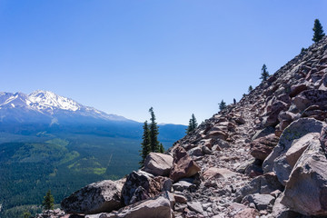 Hiking trail in Siskiyou County; Shasta mountain covered in snow visible on the left; Northern California