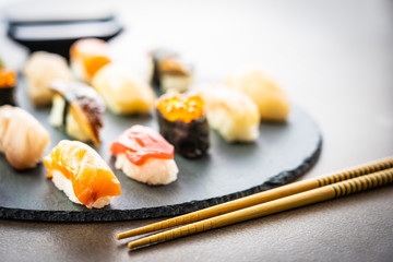 Nigiri sushi set with salmon tuna shrimp prawn eel shell and other sashimi