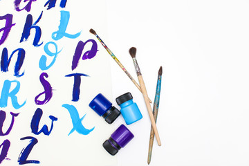 Calligraphy lettering alphabet drawn with dry brush. Letters of English ABC written with paint brush