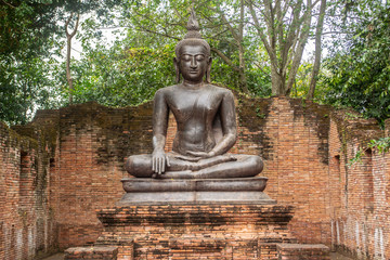 Buddha images are located outdoors. In the park in Ratchaburi province of Thailand