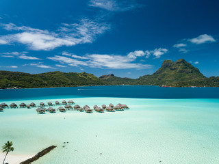 Aerial image from a drone of blue lagoon and Otemanu mountain at Bora Bora island, Tahiti, French Polynesia, South Pacific Ocean (Bora Bora Aerial).