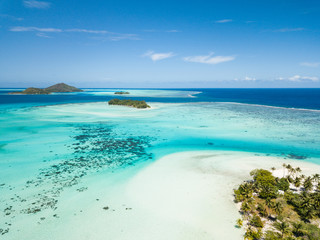 Aerial image from a drone of blue lagoon and Otemanu mountain at Bora Bora island, Tahiti, French...