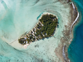 Aerial image from a drone of blue lagoon and Motu Ahuna at Bora Bora island, Tahiti, French Polynesia, South Pacific Ocean (Bora Bora Aerial)