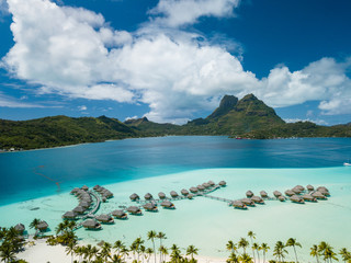 Aerial image from a drone of blue lagoon and Otemanu mountain at Bora Bora island, Tahiti, French Polynesia, South Pacific Ocean (Bora Bora Aerial). © bomboman