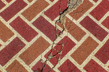 Red cracked brick paving stone grunge background background