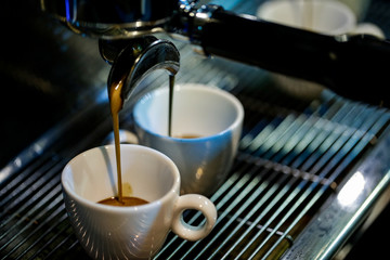 espresso shot from coffee machine in coffee shop,Coffee maker in coffee shop