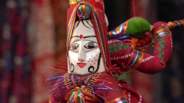 Hand made puppets attached to string in Rajasthan, India. Close up face dolls, for sale to tourists