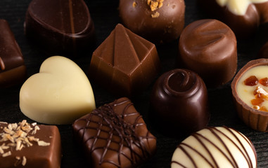 Background of Gourmet Chooclates on in a Dark Moody Setting