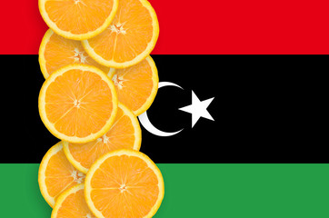 Libya flag and citrus fruit slices vertical row