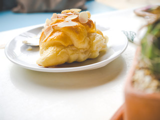Croissants with nuts on white plate