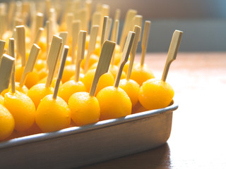 Egg yolk fudge balls with stick cooked in syrup(Tong Yod)