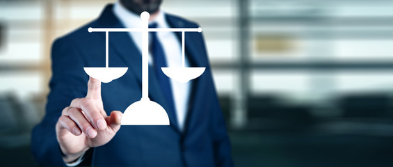 businessman holding justice icon