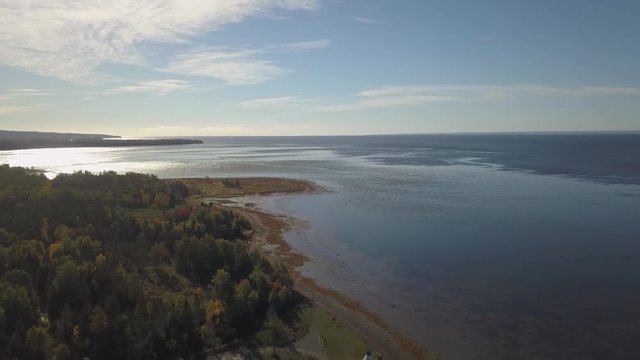 Aerial view of the Atlantic Ocean Coast during a sunny morning. Taken near Carleton, Quebec, Canada.