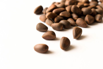 Cedar nut.  Isolated on white background. Selective focus