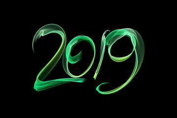 Happy new year 2019 isolated numbers lettering written with fire flame or smoke on black background