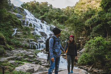 Travel relax to visit the waterfalls of couples. In the winter. at the waterfall mae ya chiangmai in thailand. travel nature. summer