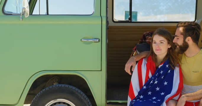 Young couple interacting with each other in van on a sunny day 4k