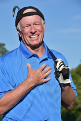 Appreciative Male Golfer With Golf Club Playing Golf