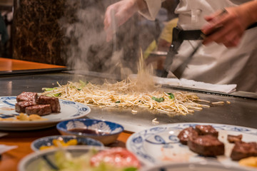 Stir fried bean sprout with beef steak on the hot pan