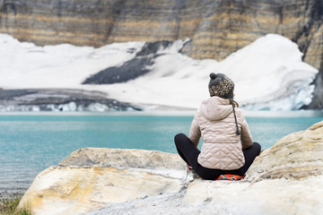 Hiker enjoying glacier lake in Glacier National Park