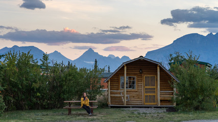 Girl enjoying sunset at the cabin in Glacier National Park