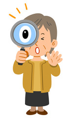 虫眼鏡を覗いて驚く中年女性　シニア　
