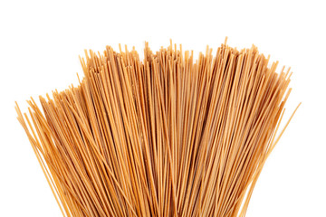 Uncooked soba, buckwheat noodles, shot from the top on a white background with a place for text