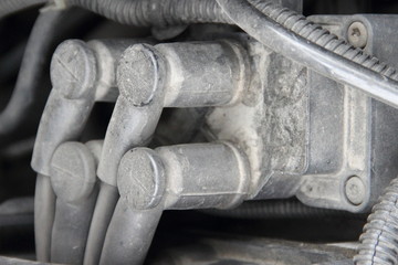 Close up 4-wires car ignition coil module - repair of vehicle electrical equipment