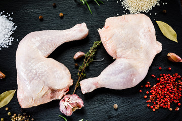 Raw chicken legs on wooden background © Jacek Chabraszewski
