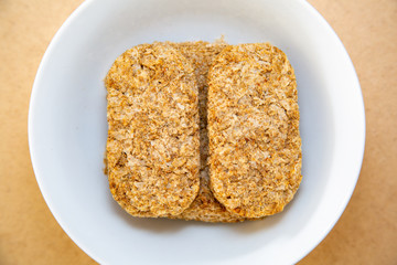Rectangular wheat biscuits in a bowl