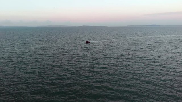 Aerial view of a boat in a sea in Howick's beach in New Zealand