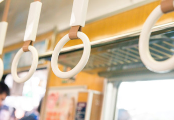 white hand holder in bus or train