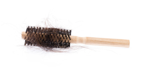 comb brush with lost hair, isolated on white background