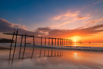 Fototapeta premium Seascape of Old wooden bridge at sunset time in Phangnga, Thailand.