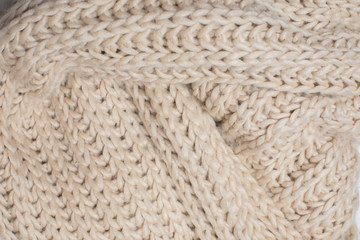 beige knitted texture, top view.