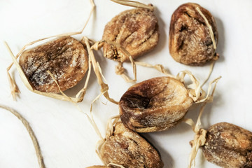 Fototapeta na wymiar Dried figs on the string; healthful food