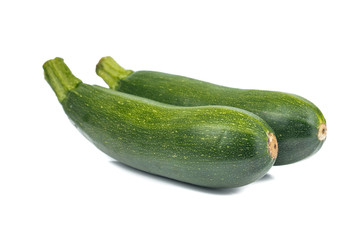 Fresh green Zucchini (Cucurbita pepo var. cylindrica) isolated on white background