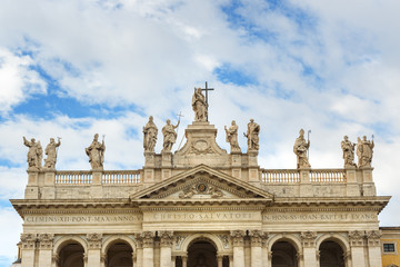 Fototapeta na wymiar Detail of facade with statues of Basilica di San Giovanni in Laterano. Rome. Italy