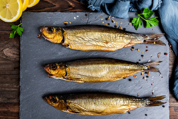 Delicious smoked salmon herring beautifully garnished on a rustic wooden table