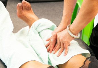 Thai massage; a traditional body treatment of reflexology made by professional therapist for...