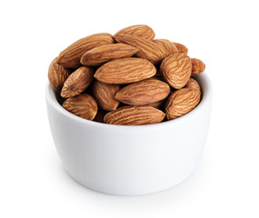 Bowl with almonds isolated on white background.