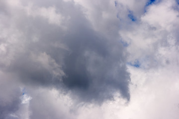 dense white clouds on a beautiful summer blue sky