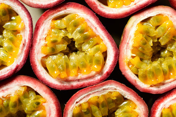 food background of fresh passion fruits, top view