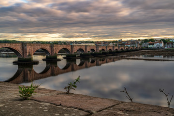 Fototapeta na wymiar Old Bridge over the River Tweed in Berwick-upon-Tweed, Northumberland, England, UK