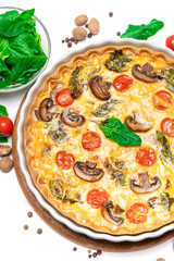 Baked homemade quiche pie in ceramic baking form