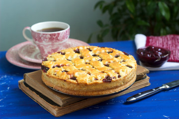 A traditional American or European cherry pie made of shortcake. Rustic style.
