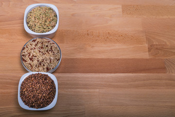 The concept of natural healthy food. Grains of various beans in small cups