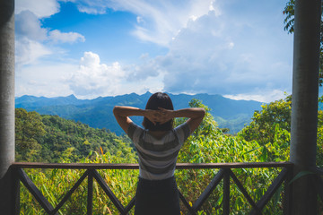 Fototapeta na wymiar Happy young cute asian Japanese girl hipster backpack women travelling looking at beautiful sky mountains scenery views 